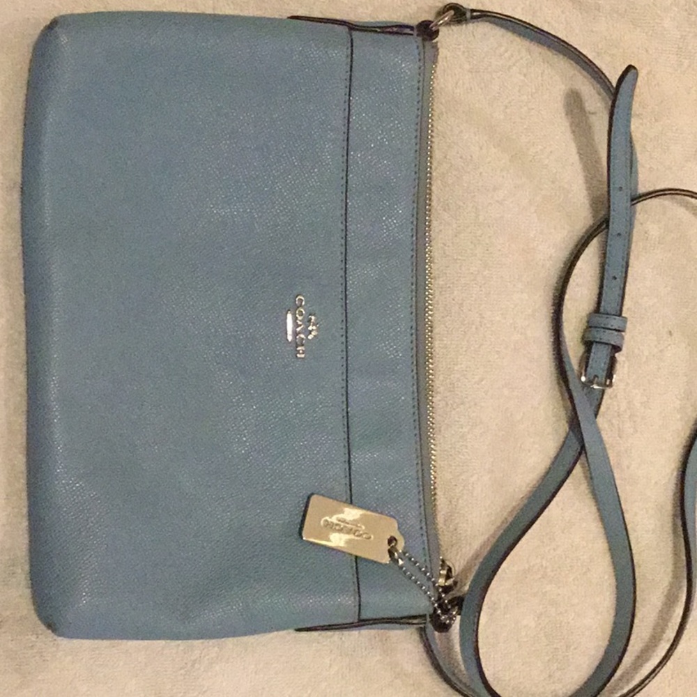 Pale/baby blue Coach cross body bag